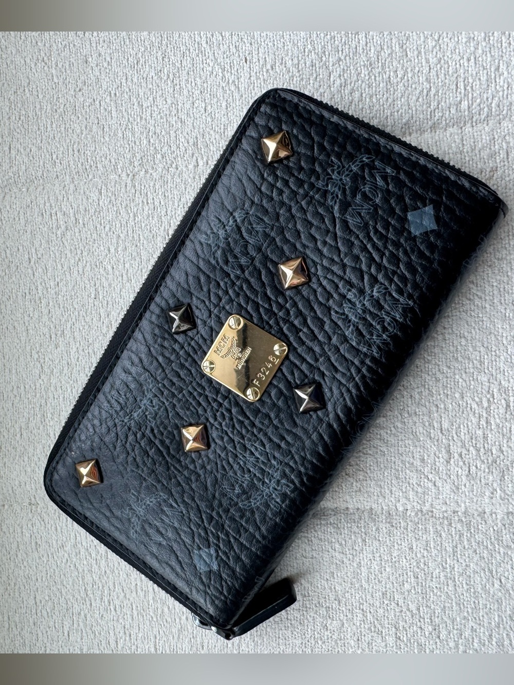 MCM Black Textured Leather Zip Wallet with Gold Logo Plaque